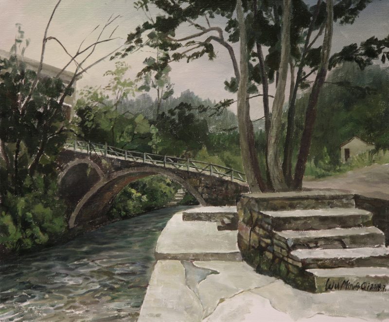 In Zhenyuan, the slanting bridge rests above emerald waters,